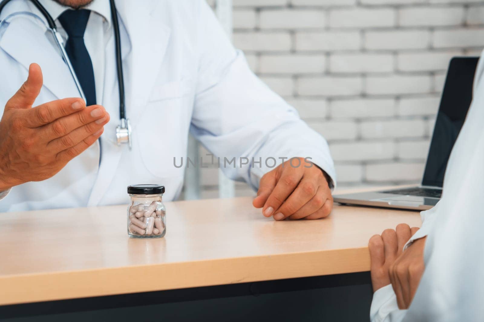 Doctor in professional uniform examining patient at hospital Jivy by biancoblue