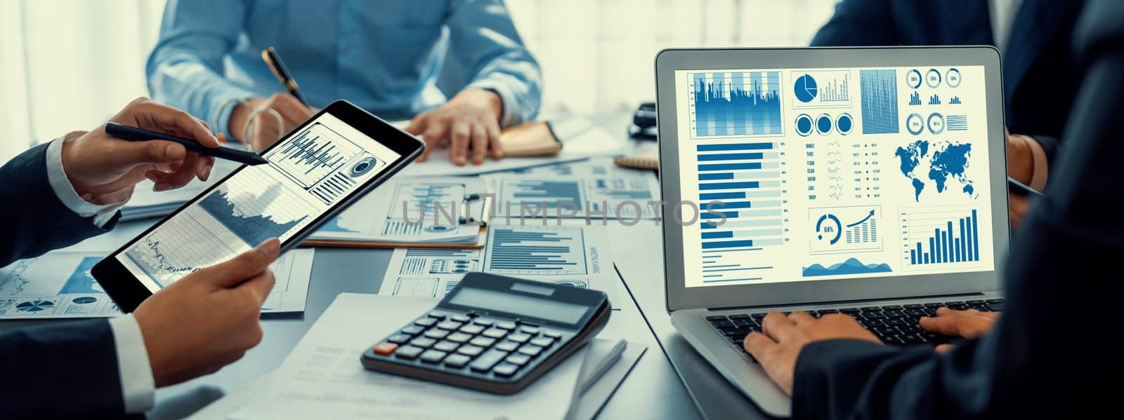 Business intelligence and data analysis concept. Analyst team working on financial data analysis dashboard on laptop screen as marketing indication for effective business strategic planning. Insight