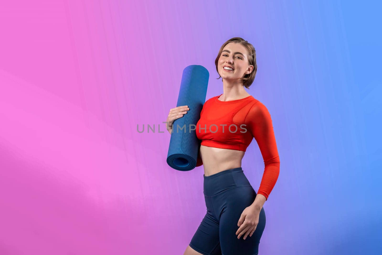 Full body length gaiety shot athletic sporty woman in fitness exercise posture by biancoblue