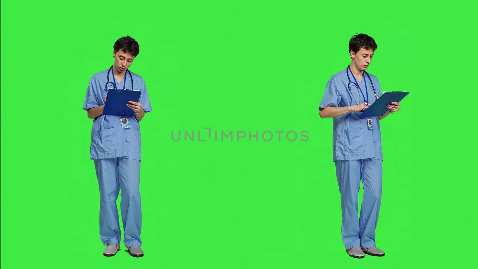 Medical assistant writing checkup information on clipboard files, taking notes and making doctor appointments with checklist. Nurse wearing blue scrubs stands against greenscreen backdrop. Camera A.