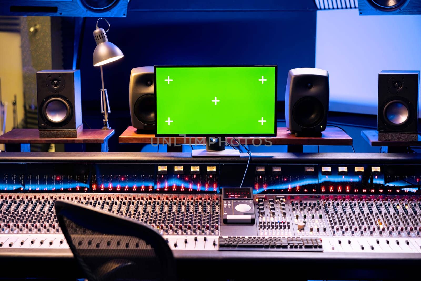 Empty studio control room with greenscreen isolated monitor by DCStudio