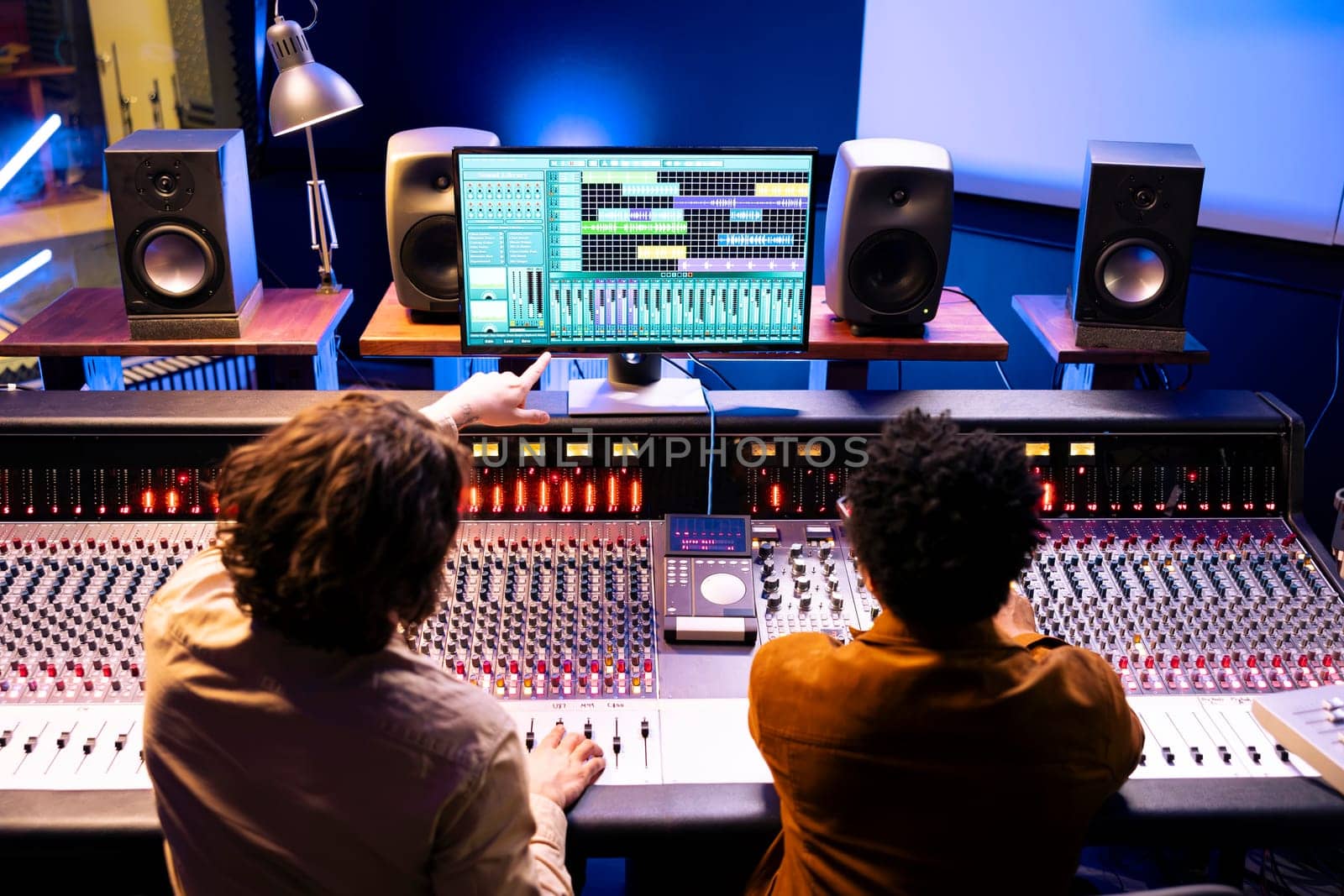 Audio engineer and artist collaborating on new songs for pop album by DCStudio