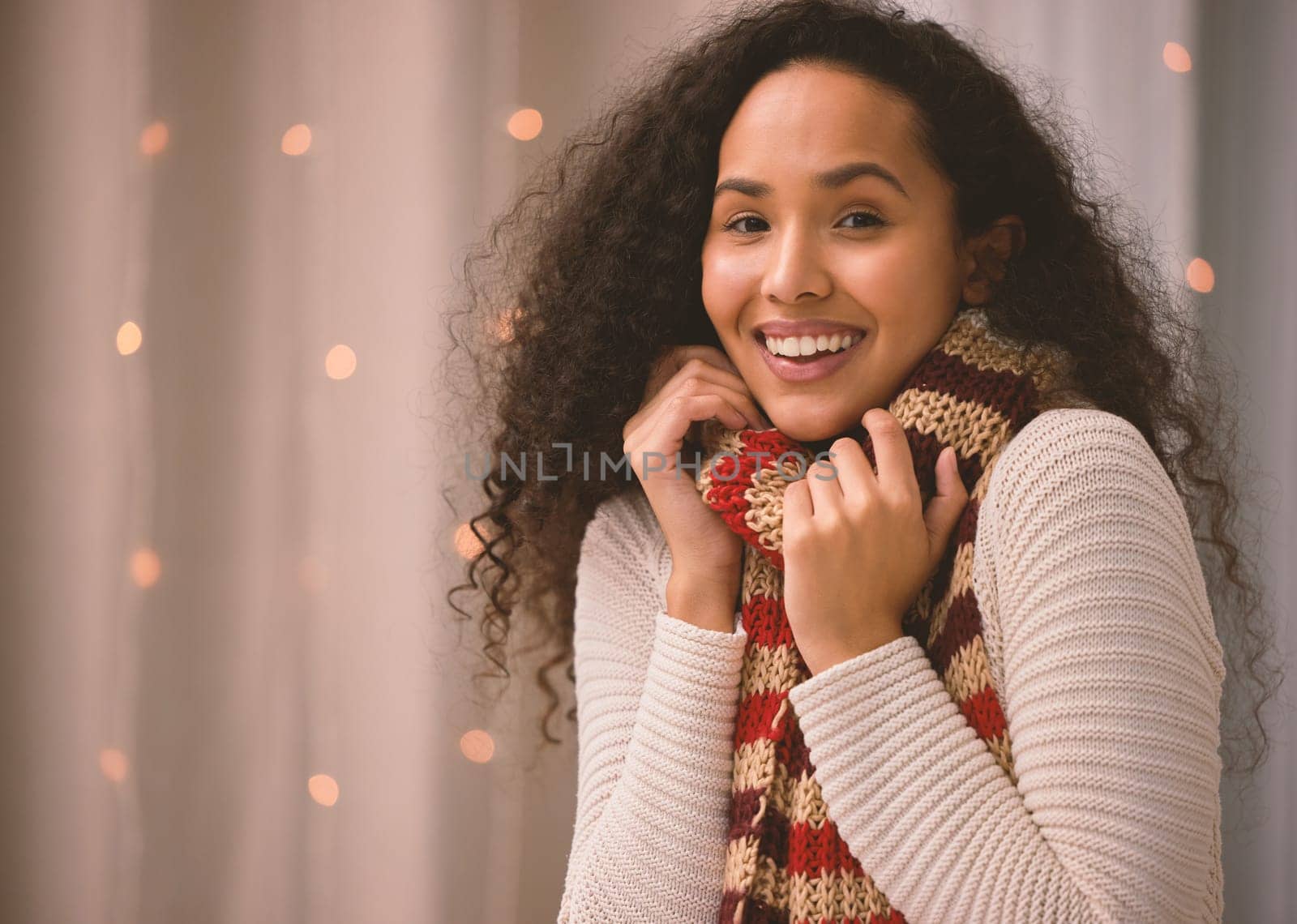 Woman, winter and portrait with scarf in home, festive lights and Christmas or smile for comfort in cold season. Cozy, warm and Columbia female person, cheerful and xmas spirit on holiday or vacation.