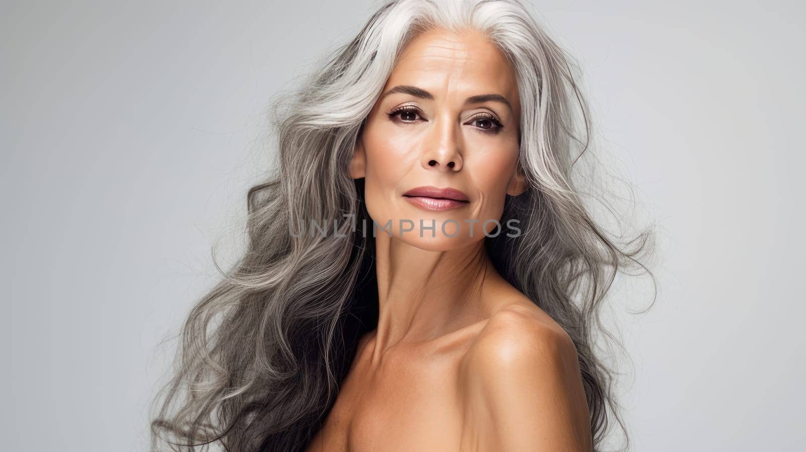 Elegant, elderly, chic Latino, Spain woman with gray long hair and perfect skin, white background, banner. Advertising of cosmetic products, spa treatments, shampoos and hair care products, dentistry and medicine, perfumes and cosmetology for women