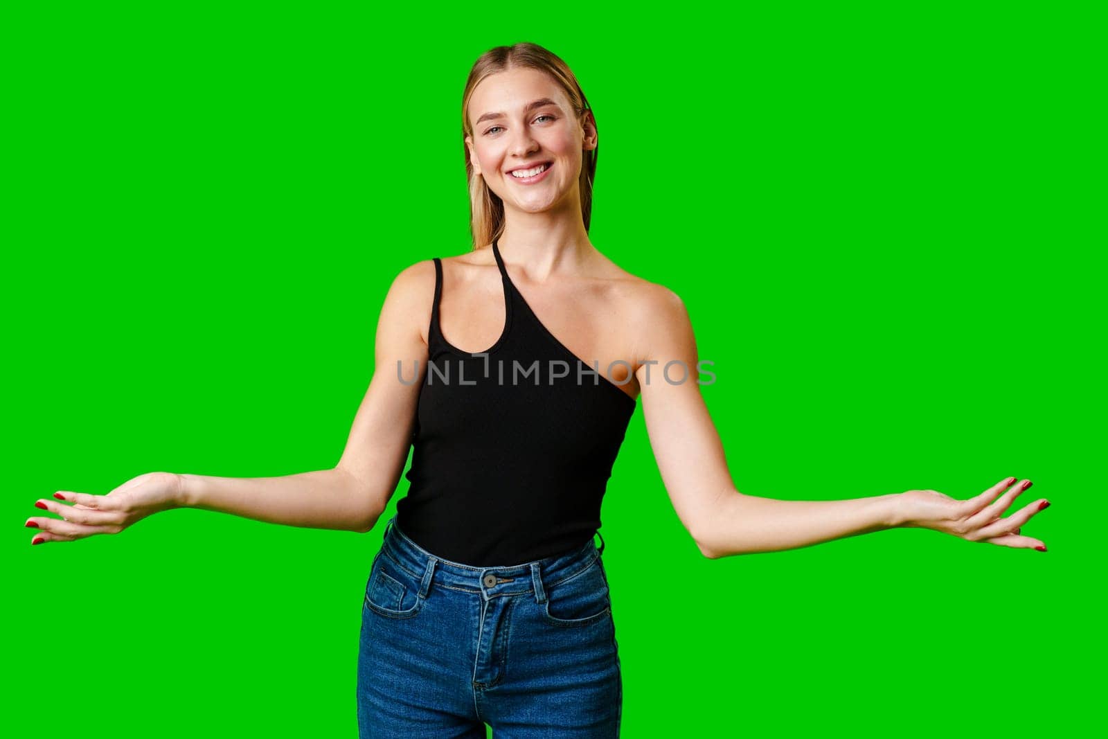 Young Woman Holding Out Hands against green background by Fabrikasimf
