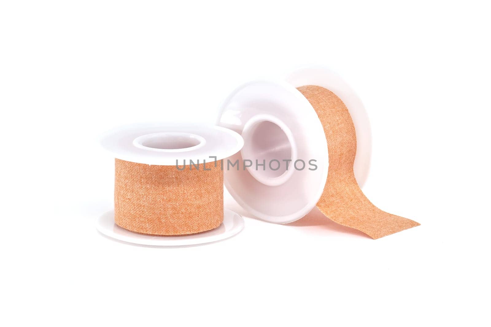 Two rolls of surgical adhesive plasters isolated on white background, medical supplies