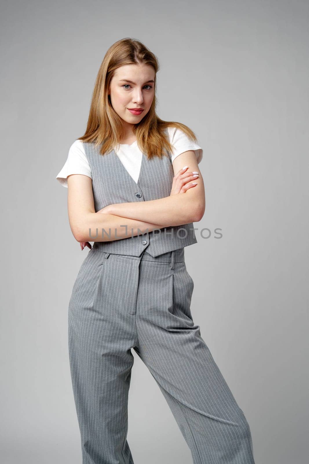 Young Woman Wearing Gray Suit and White Shirt by Fabrikasimf