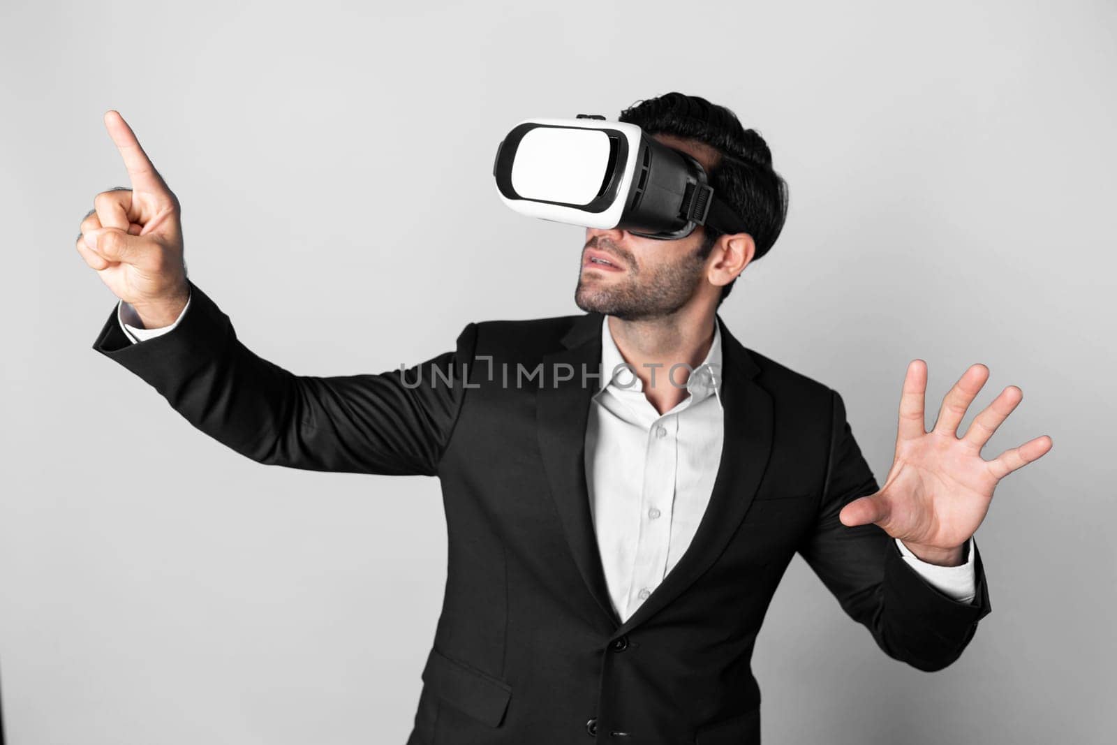 Businessman looking at data analysis while wearing VR glass and suit. Deviation. by biancoblue
