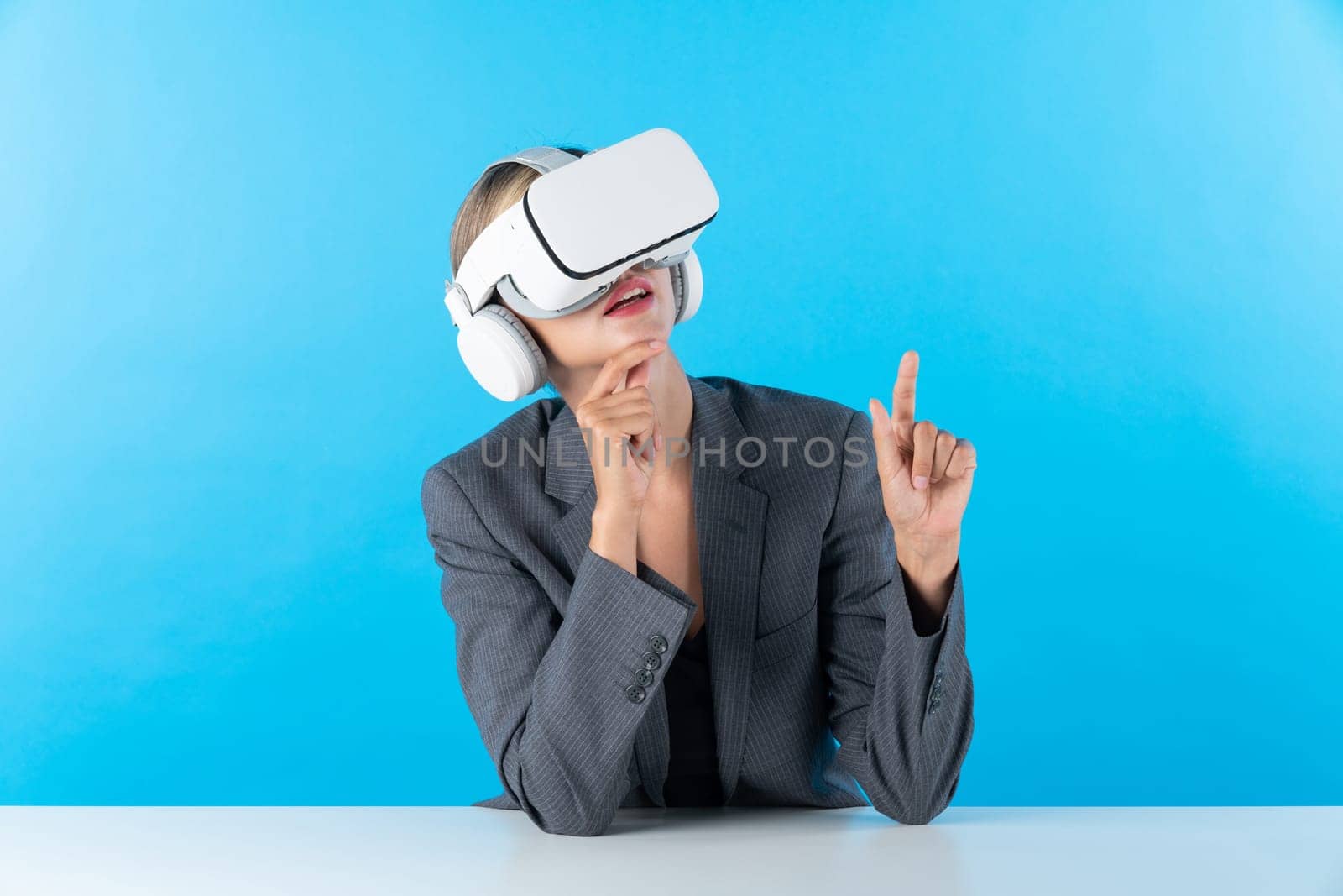 Smart business woman compare data analysis while using VR goggles. Contraption. by biancoblue