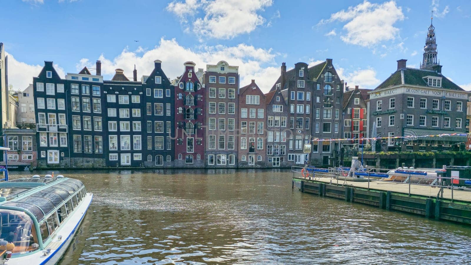 A picturesque scene of a boat gracefully sailing down a river, surrounded by towering city buildings in the background by fokkebok