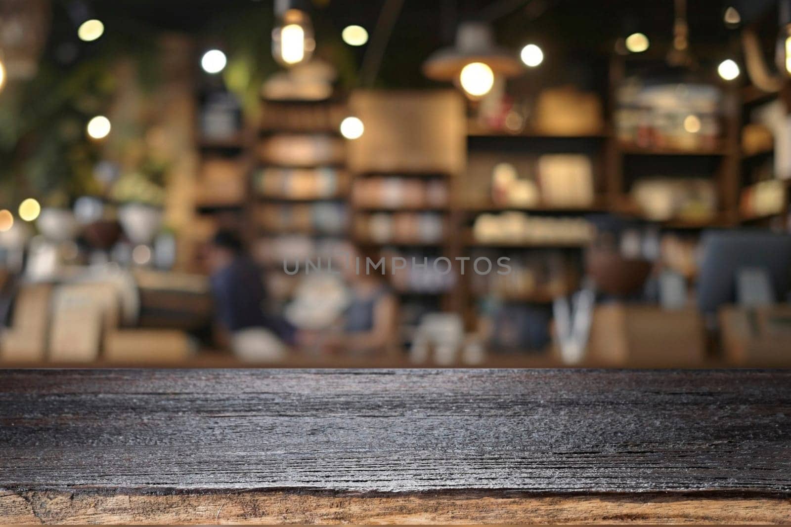 Empty wooden table for present product on coffee shop blur background. by ijeab