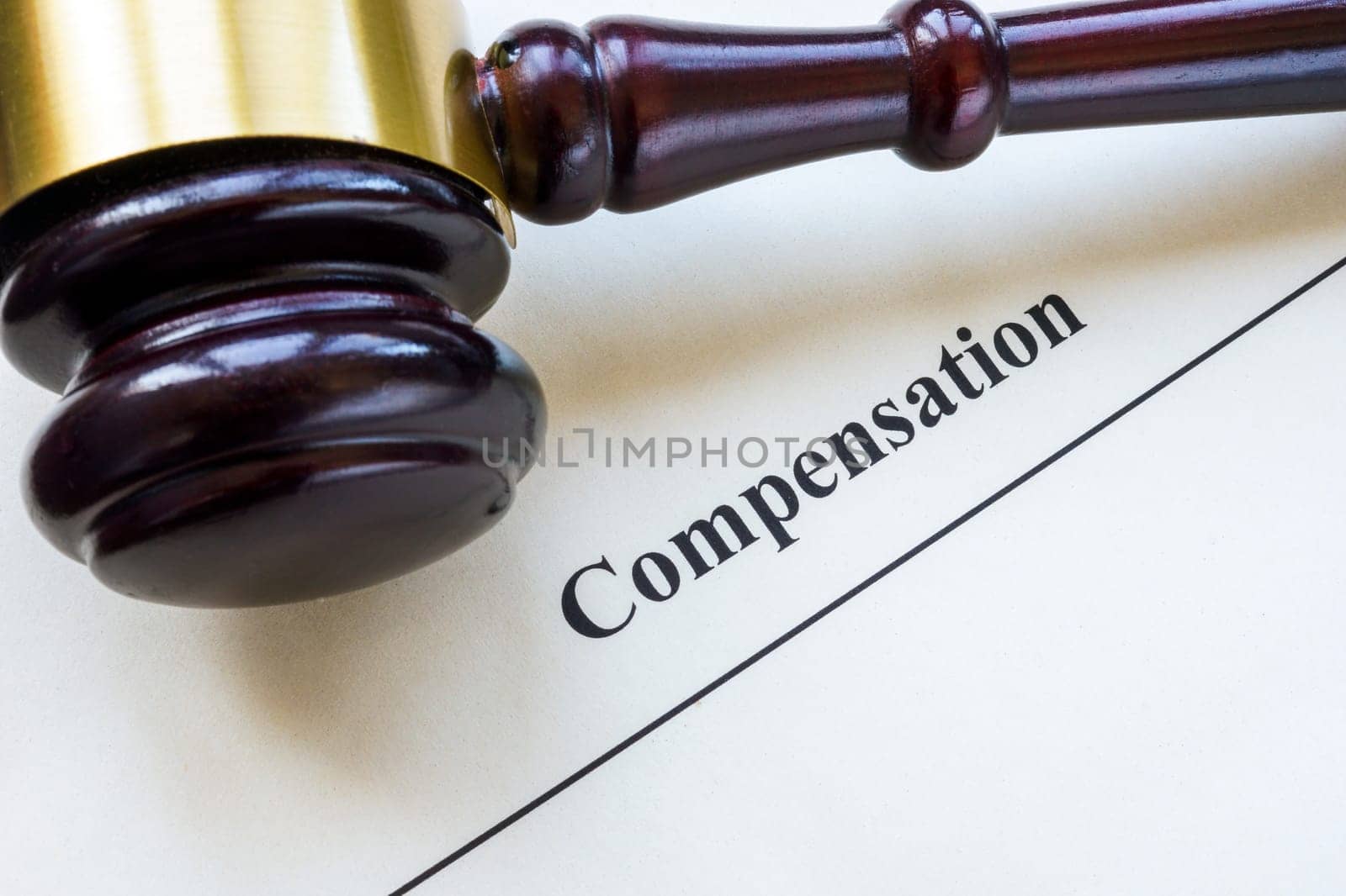 Document about compensation and gavel. by designer491