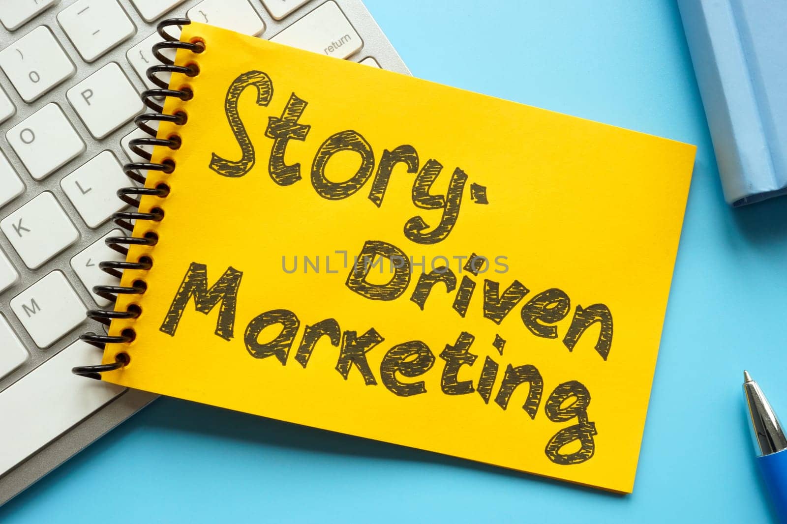 Story-driven marketing. The notepad is on the keyboard. by designer491