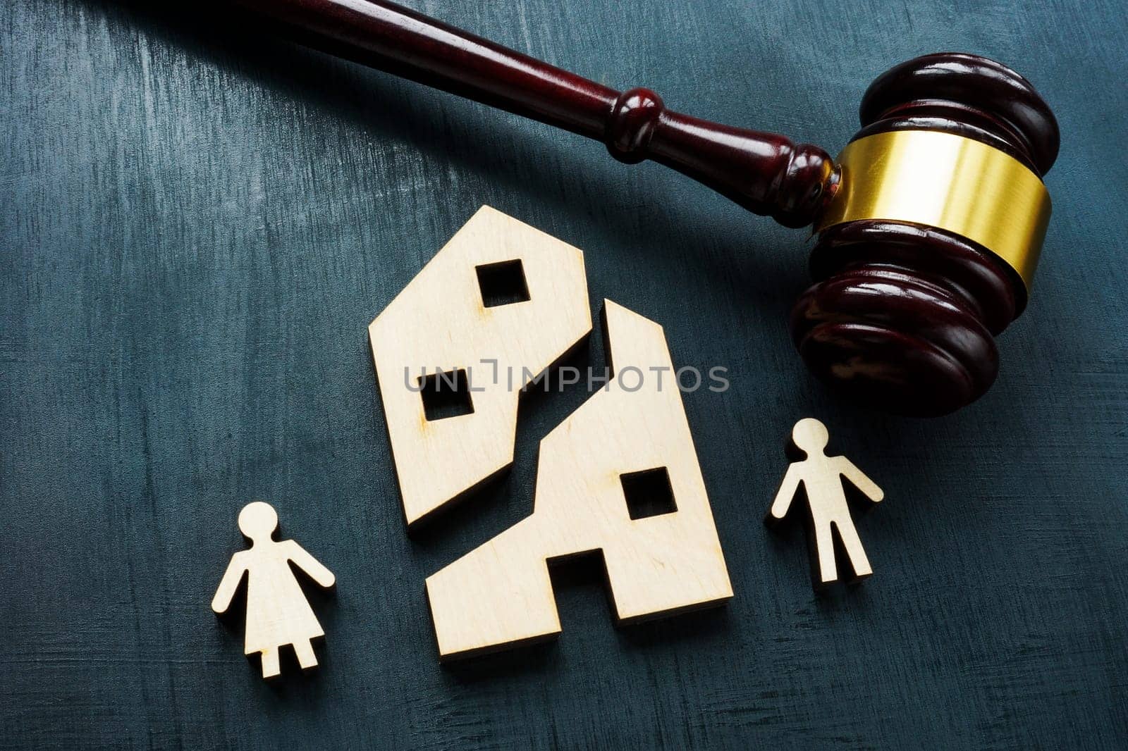 Property division concept. Divided house during family divorce and gavel.