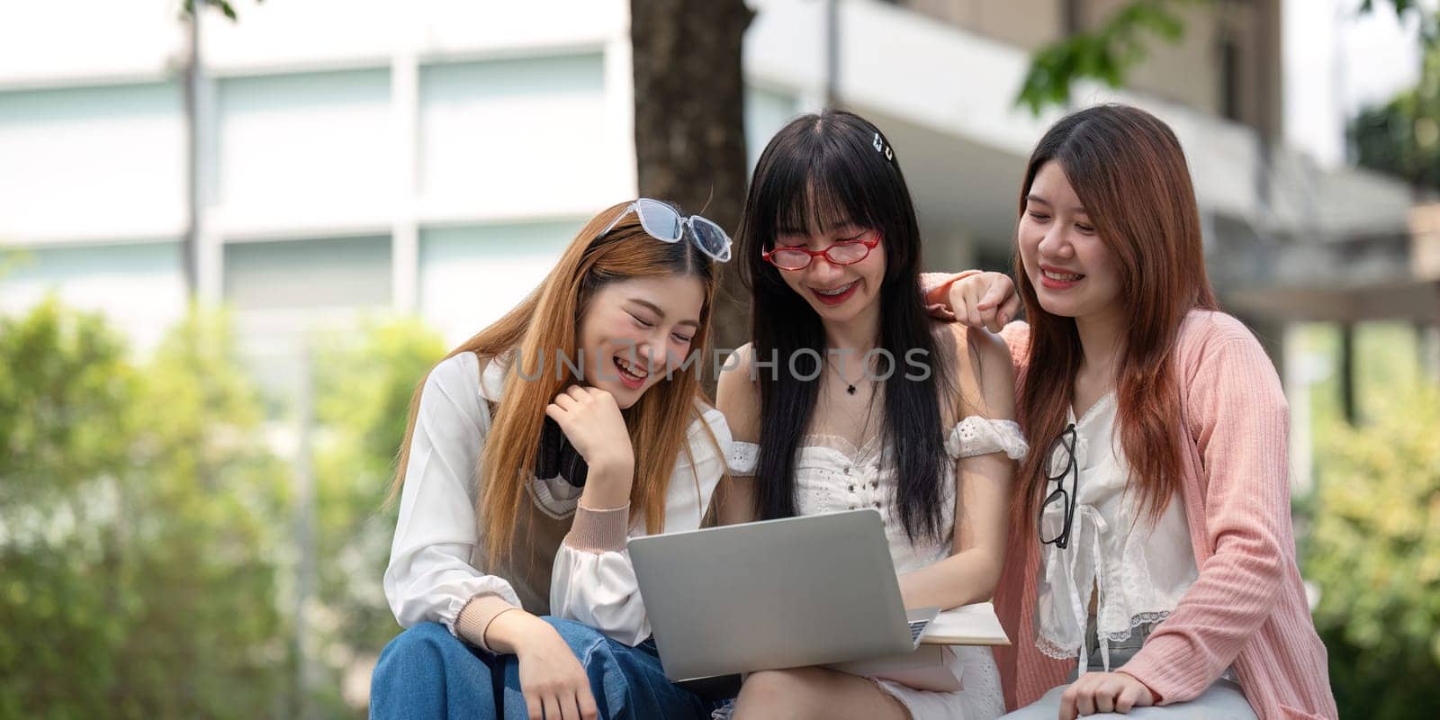 Asian young campus student enjoy learn study and reading books together. Friendship and Education concept. Campus school and university. Happiness and funny of learning in college.