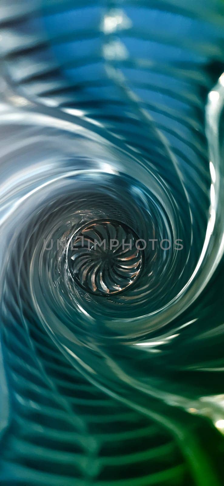 Creative background image. Spiral funnel with an ornament in the center.