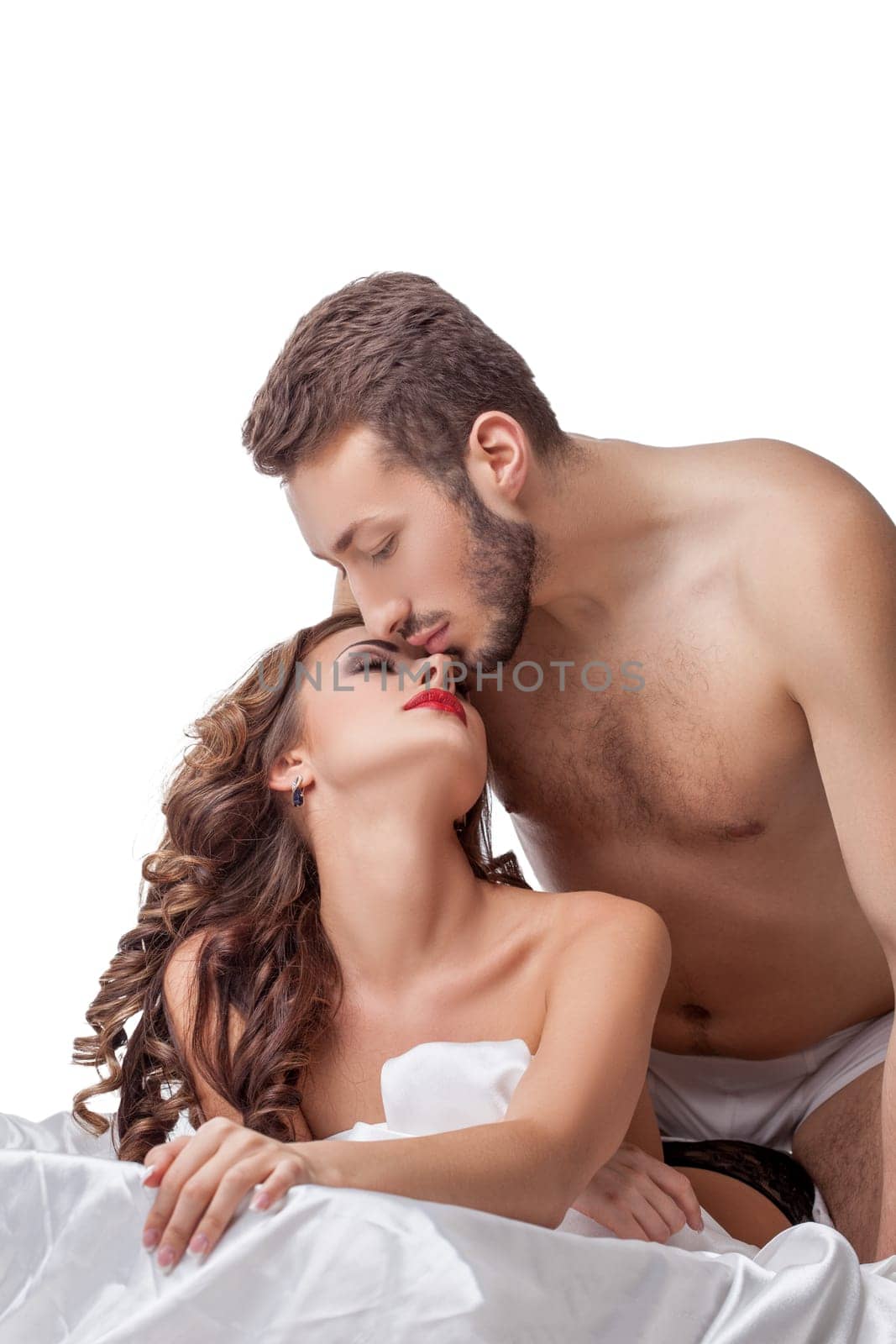 Studio portrait of lovers tenderly touching each other