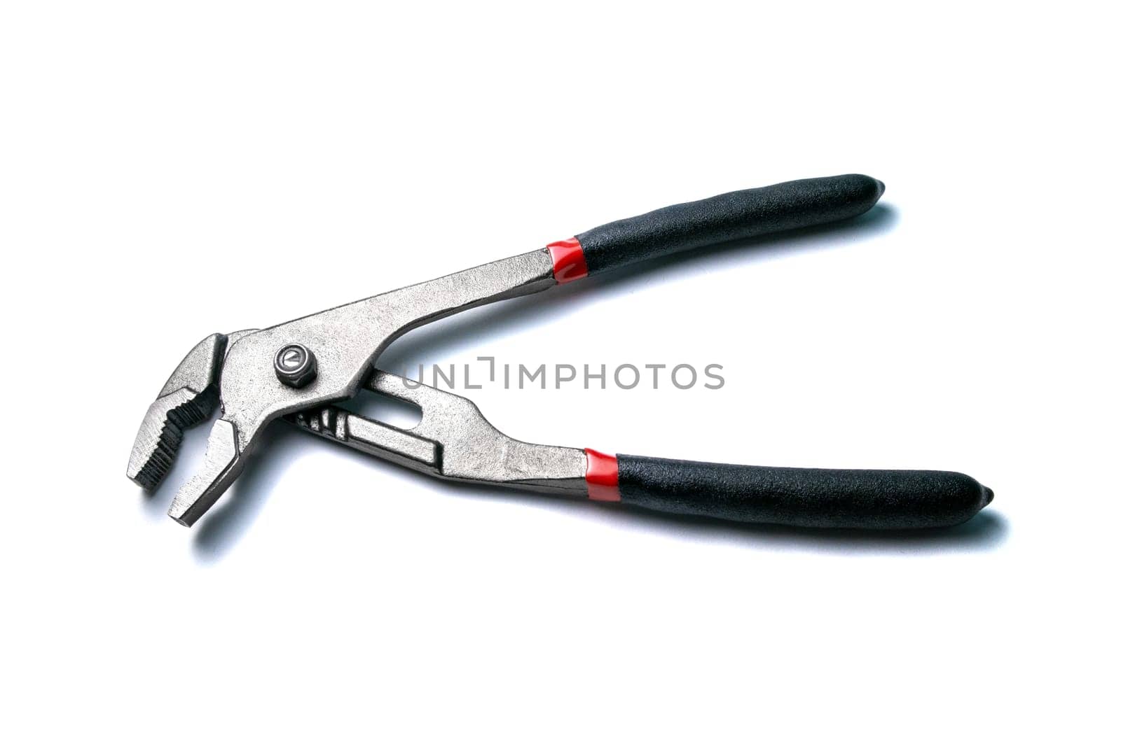 New open nut wrenches, adjustable pliers isolated on white, close-up macro view