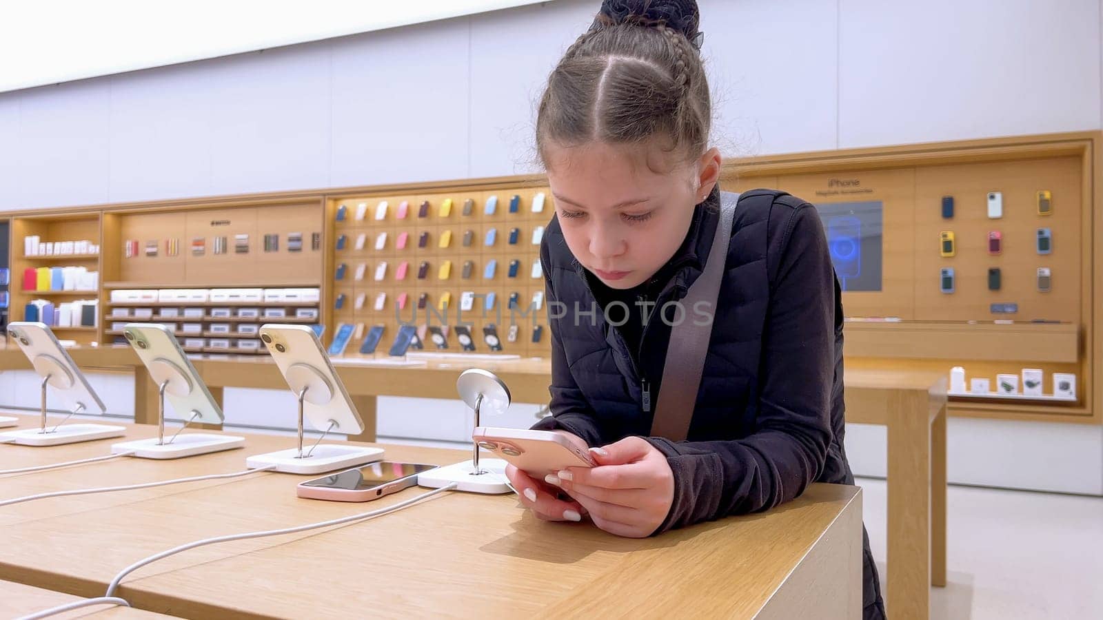 Little Girl Exploring New iPhones at Apple Store in Park Meadows Mall by arinahabich