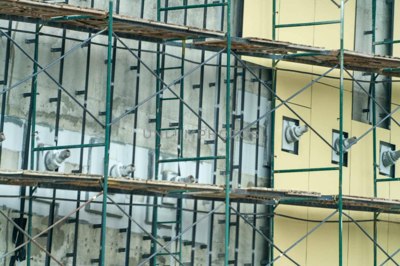 A building under construction with scaffolding and a lot of birds by Matiunina