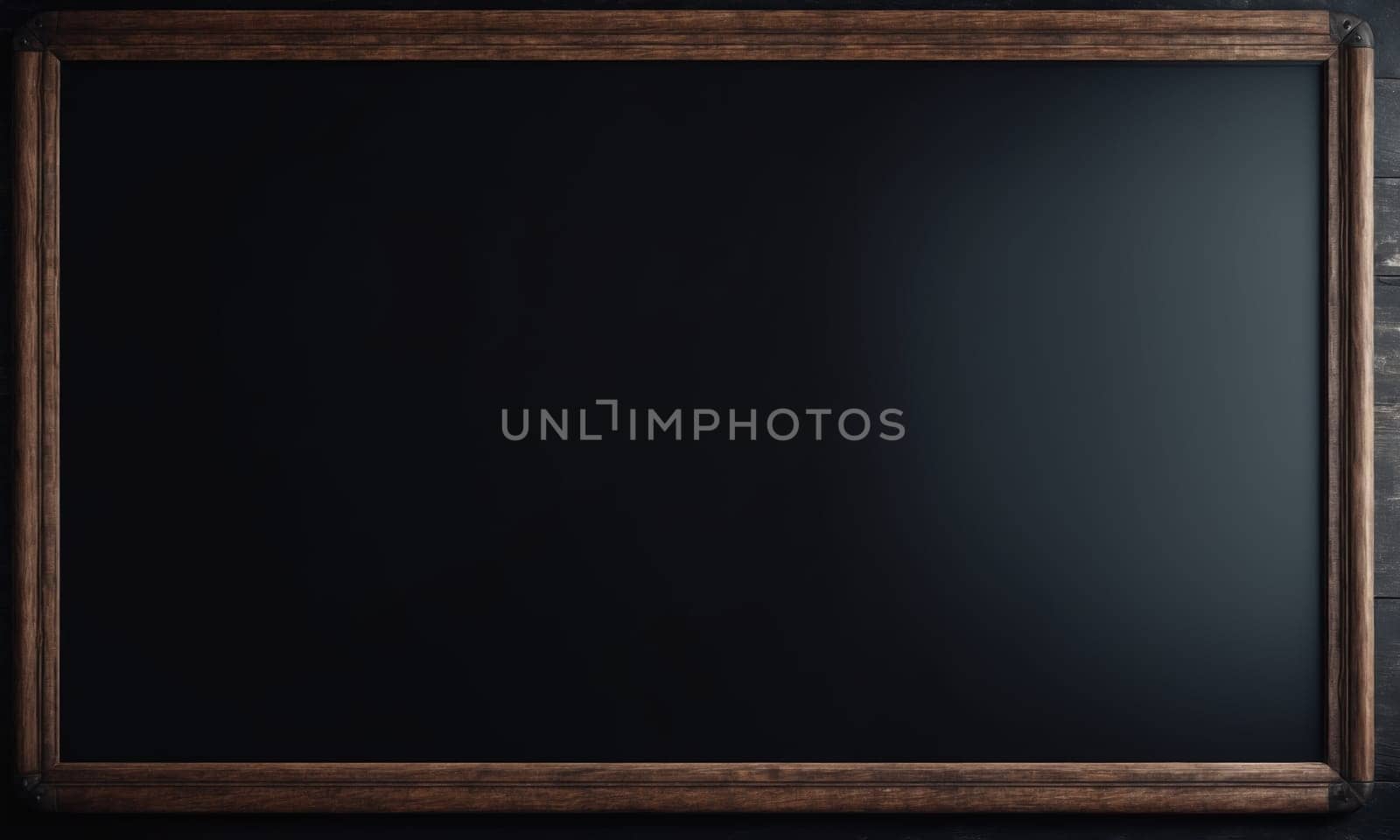 Blank blackboard with wooden frame on a dark wooden background