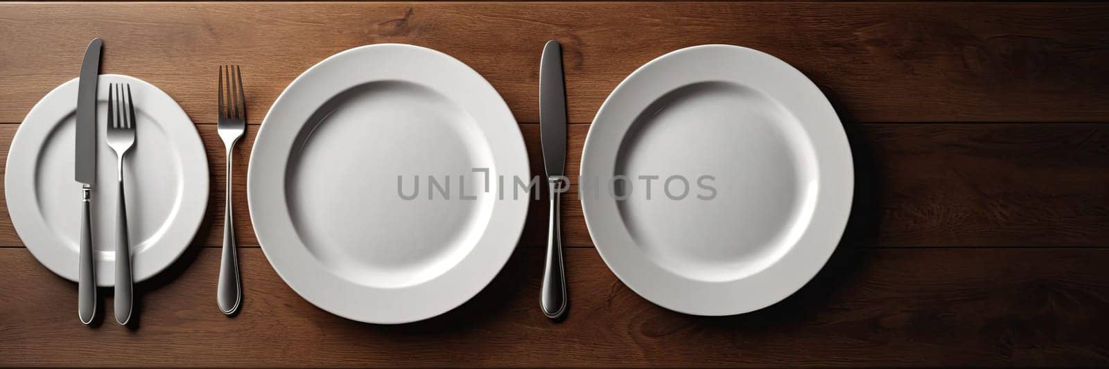 A set of silverware and plates are arranged on a wooden table. The arrangement of the plates and silverware creates a sense of order and cleanliness