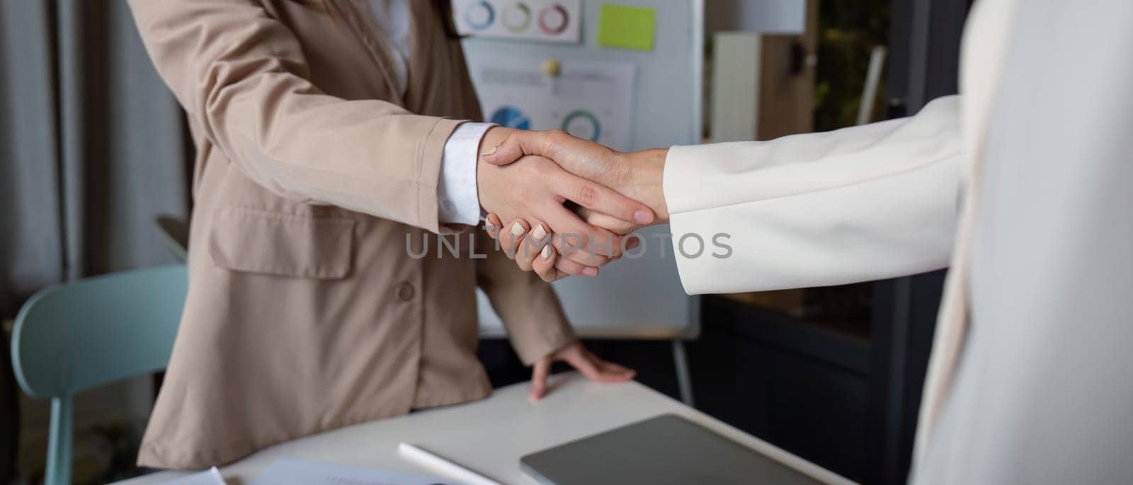 Business handshake for teamwork , Successful negotiate, Two businessman shake hand with partner to celebration partnership and business deal concept.