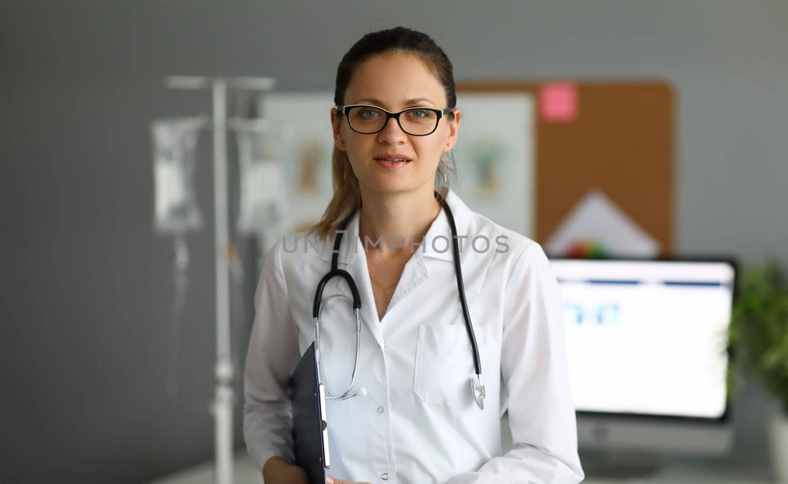Adult caucasian female doctor against hospital office background portrait, Medical education concept.