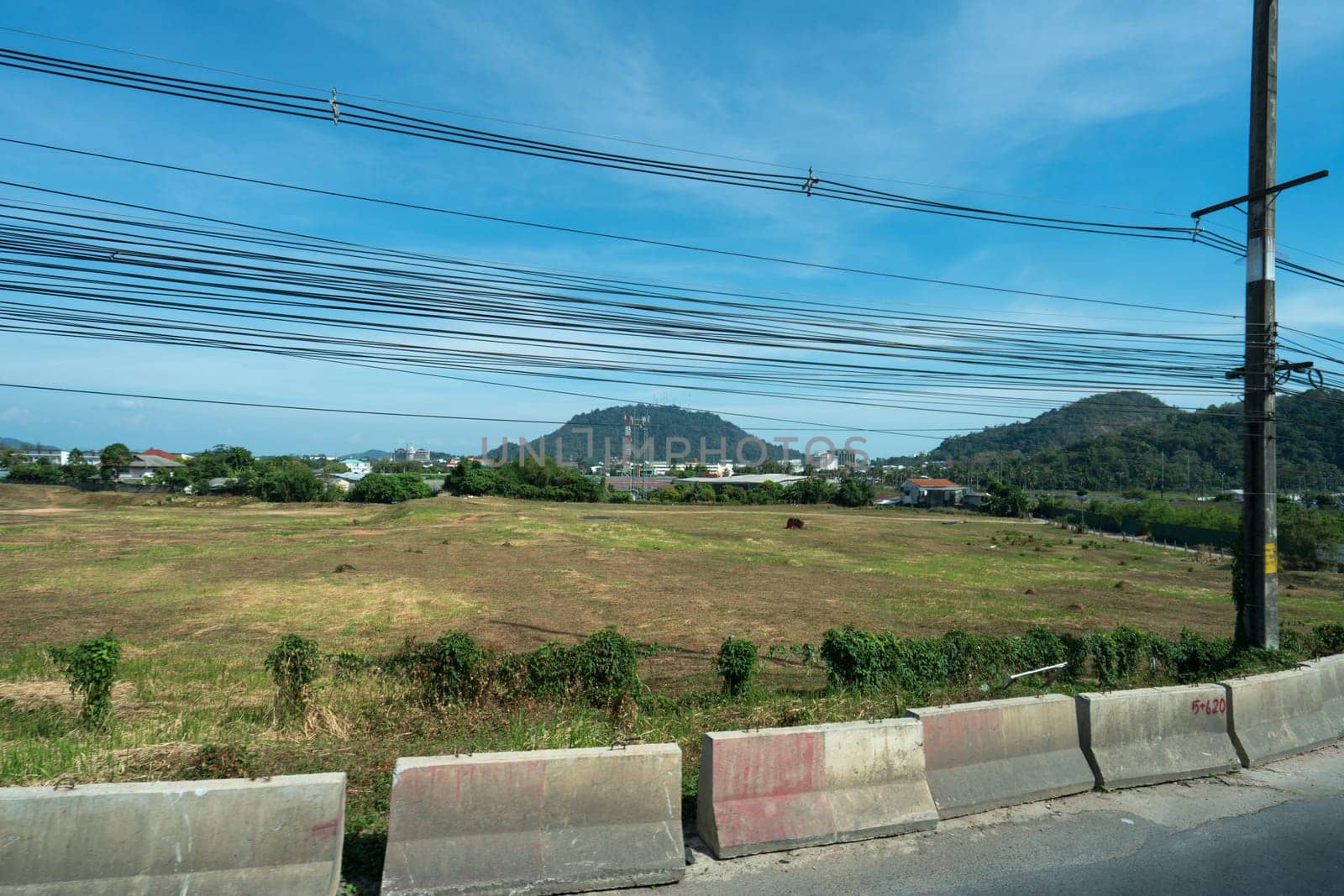 Image of electrical and communication wires in countryside. Thailand