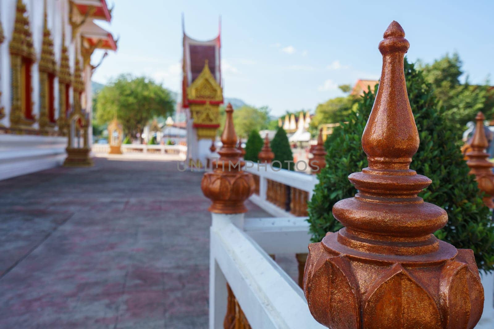 Ornate fence of Thai temple, close-up. Phuket, Thailand