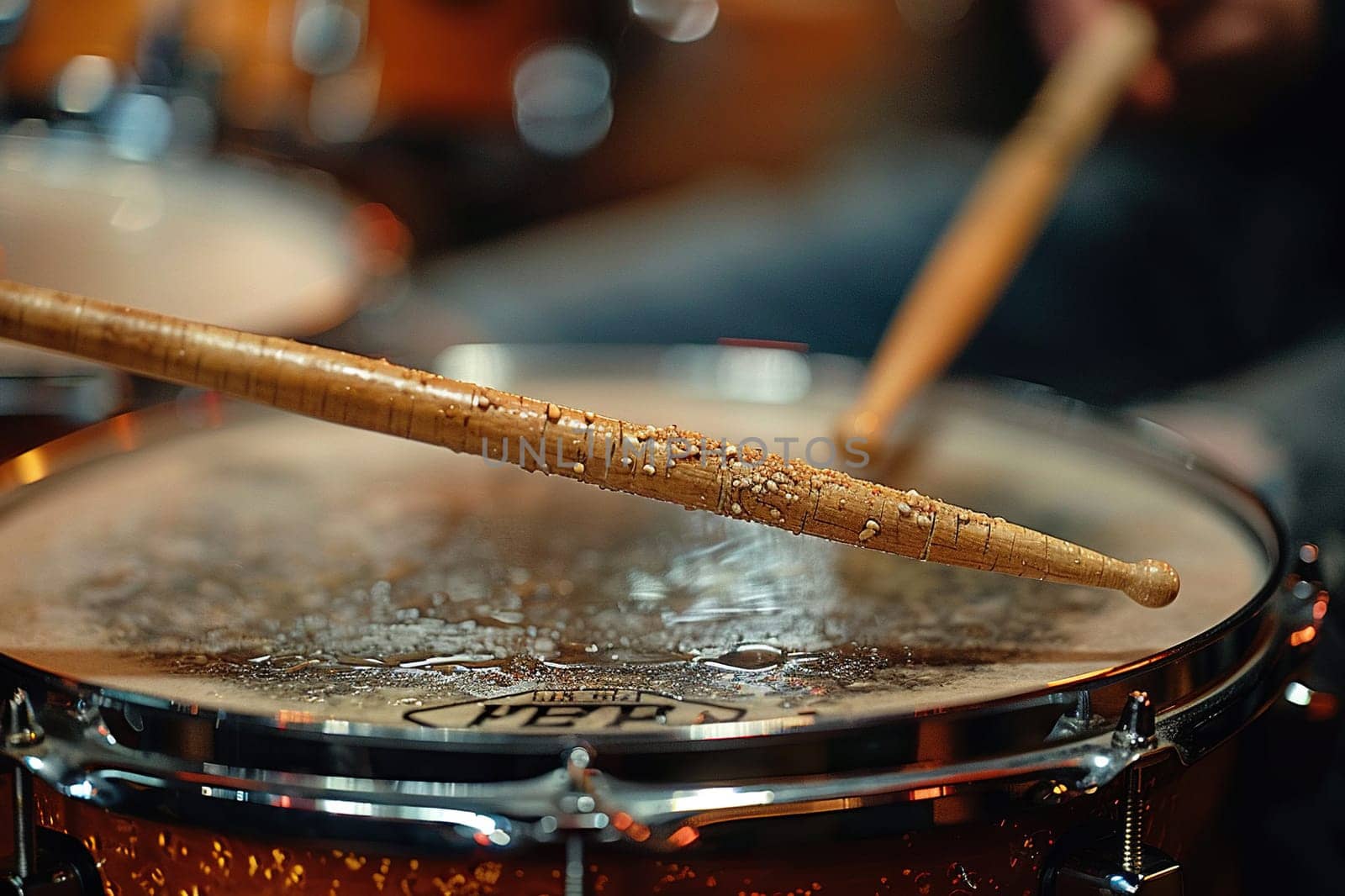 Drumsticks on a wet drum, close-up. Live music concept. Generative AI by Vovmar