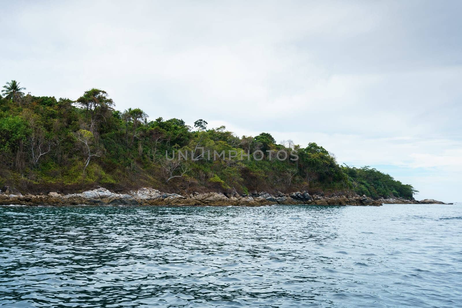 Seascape while boating. View of island coast by rivertime