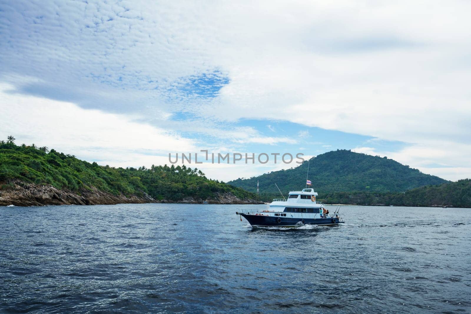 Seascape - boat on background of tropical island by rivertime