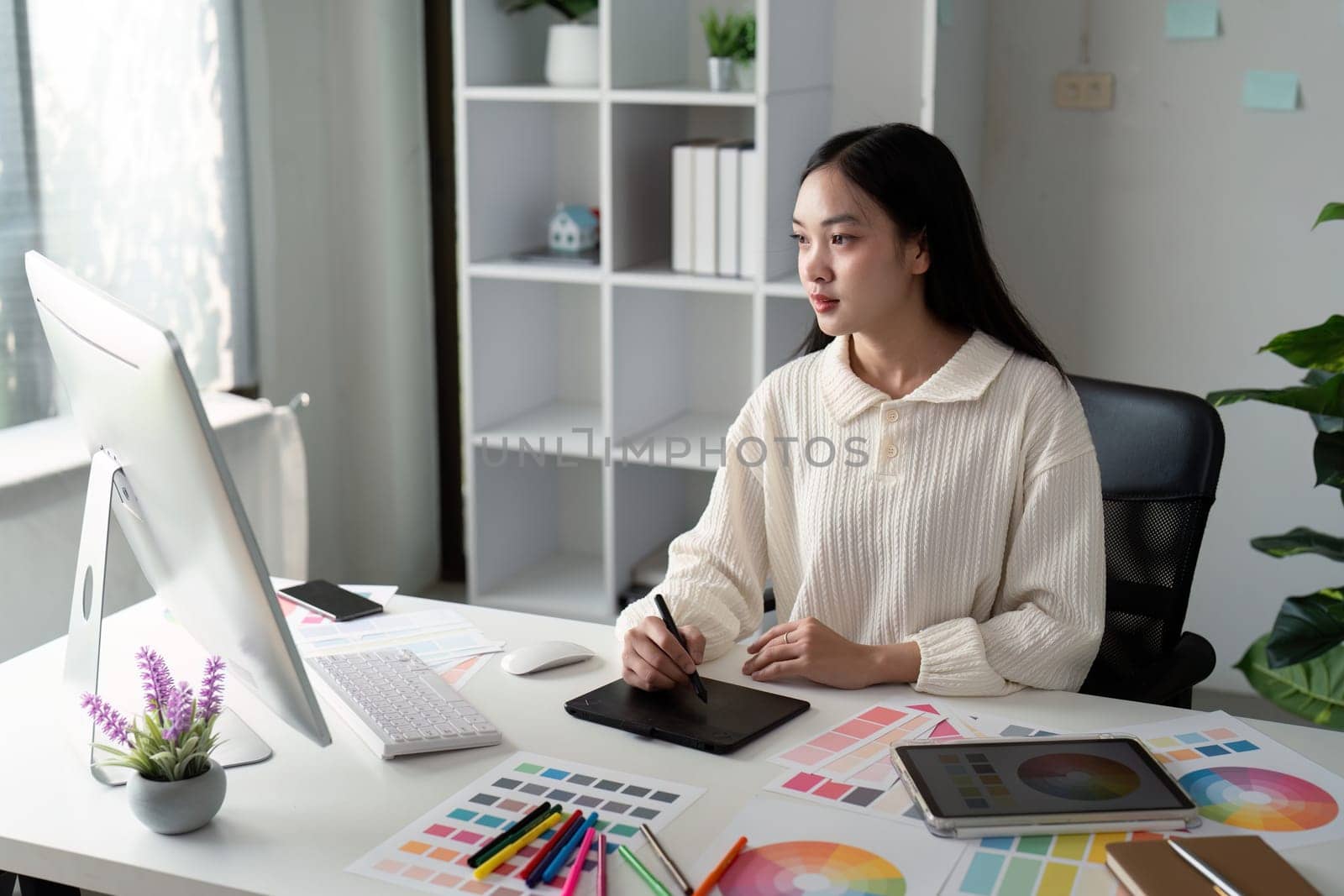Asian woman graphic designer working in home office. Artist creative designer illustrator graphic skill concept.