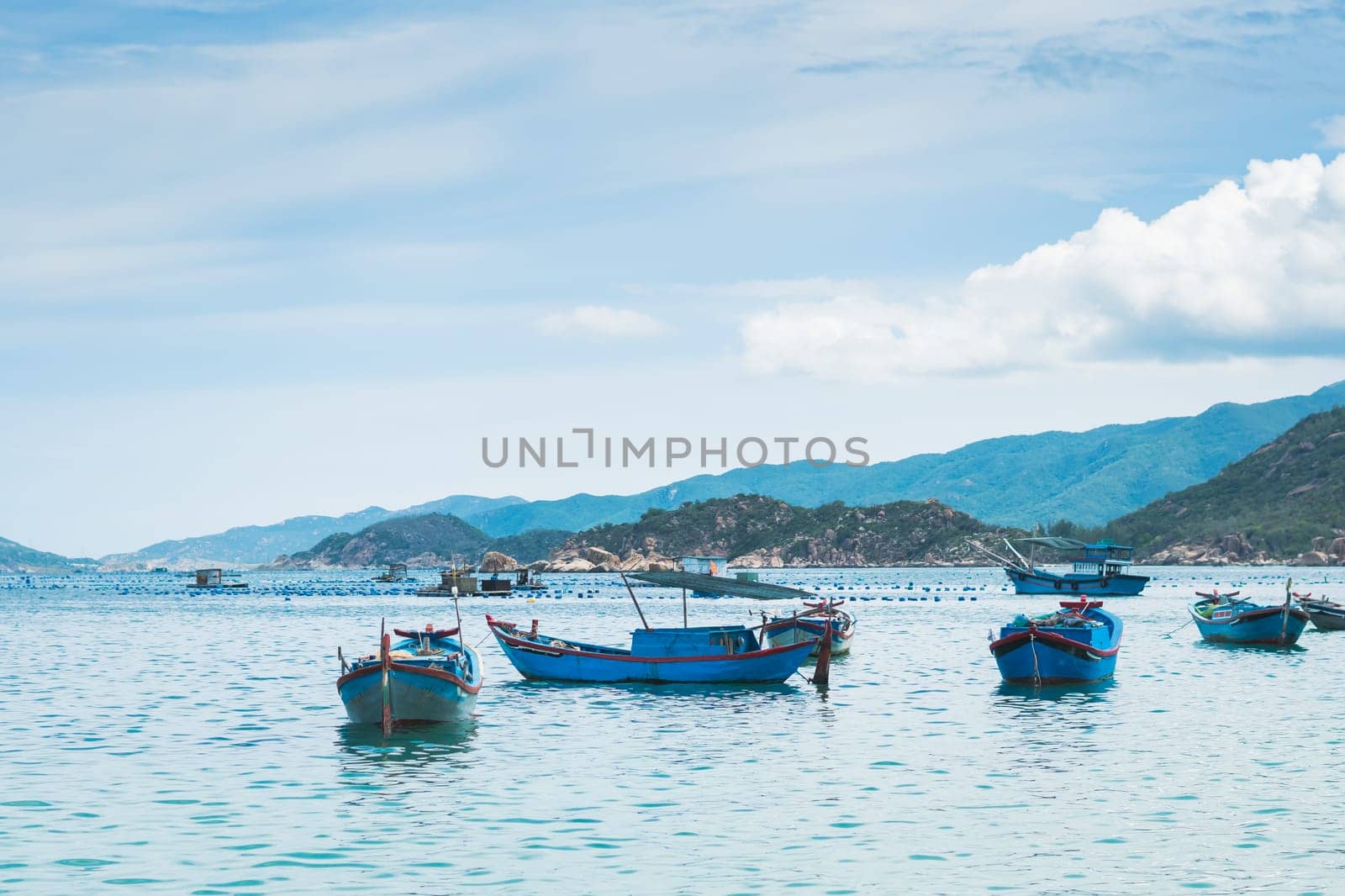 Beautiful sea landscape panorama. Green forested mountains island . Fishing boats near beach. Nature background. Tranquility calm ocean relax energy.