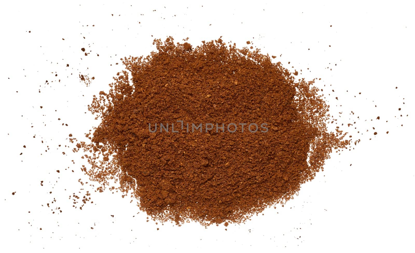 Scattered ground coffee beans on isolated background, top view