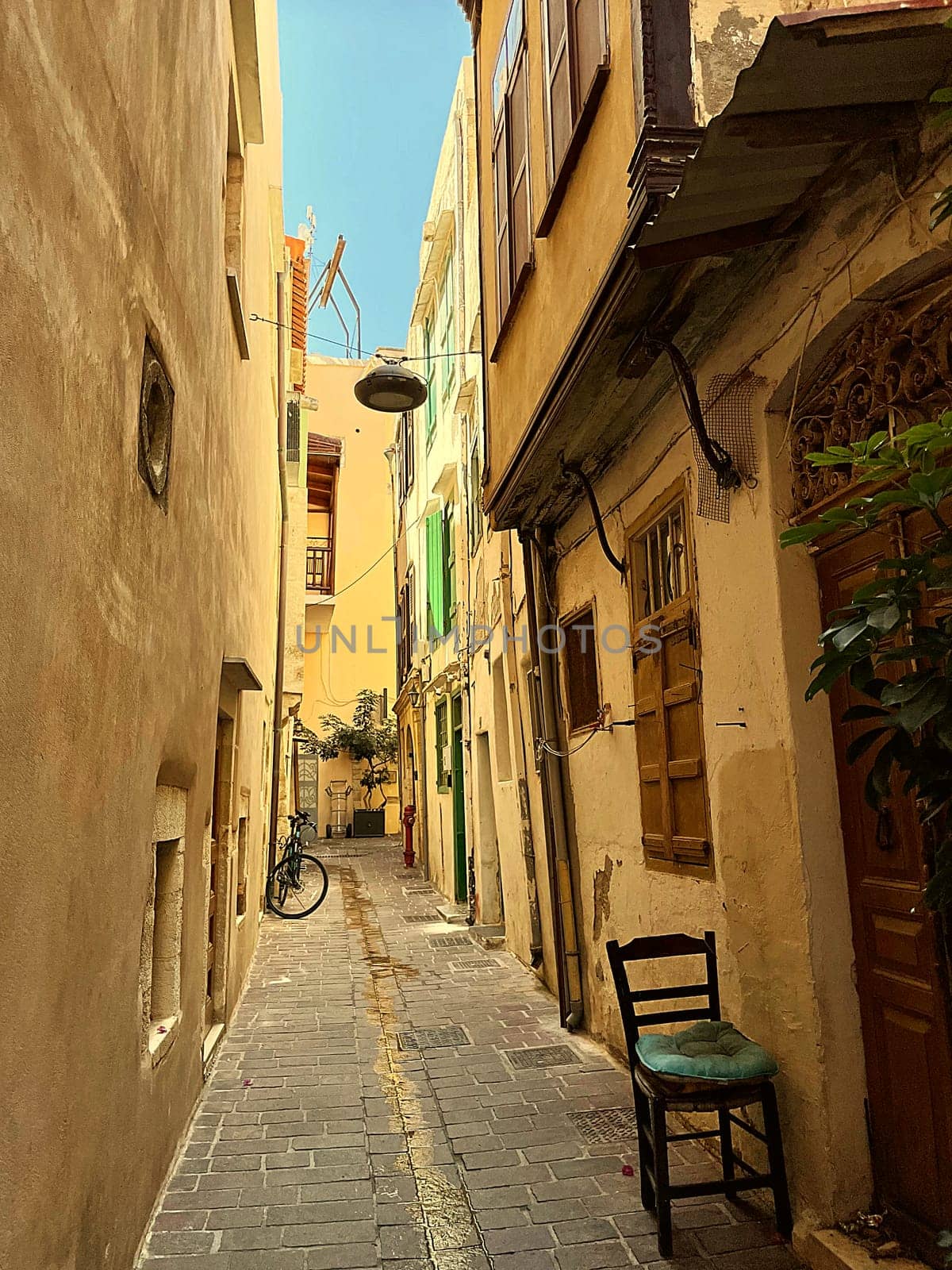 Beautiful old buildings, streets, stairs and alley ways in the town of Chania, Greece at 10 August 2023 by Costin