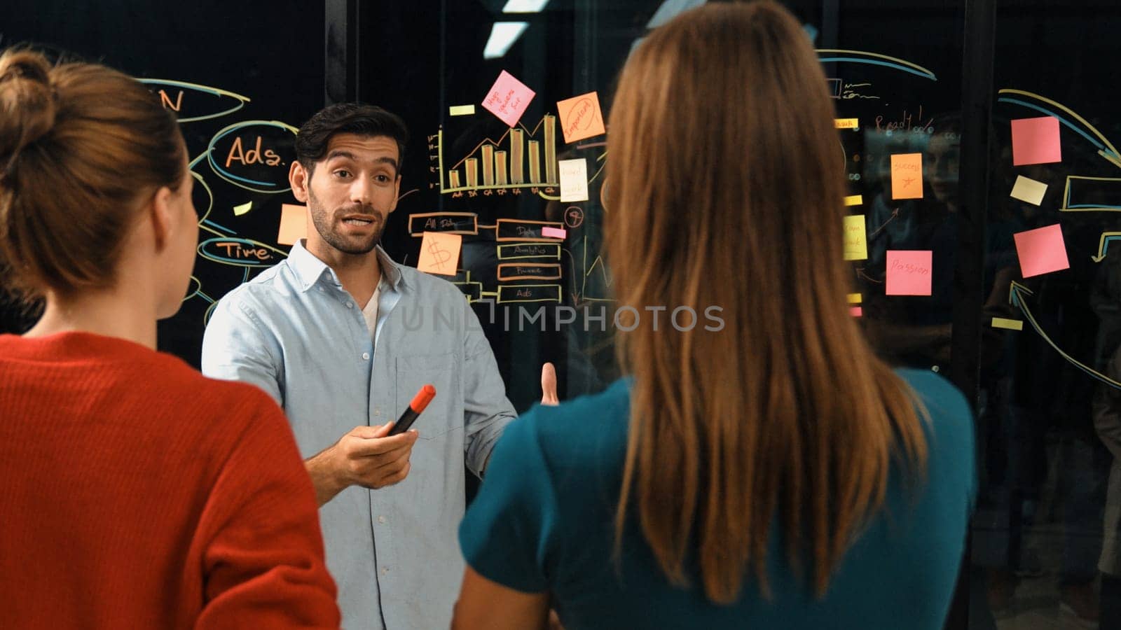 Professional businessman presenting marketing idea or financial plan to smart investor. Executive manager sharing, talking, working together with cooperative colleagues. Business concept. Tracery