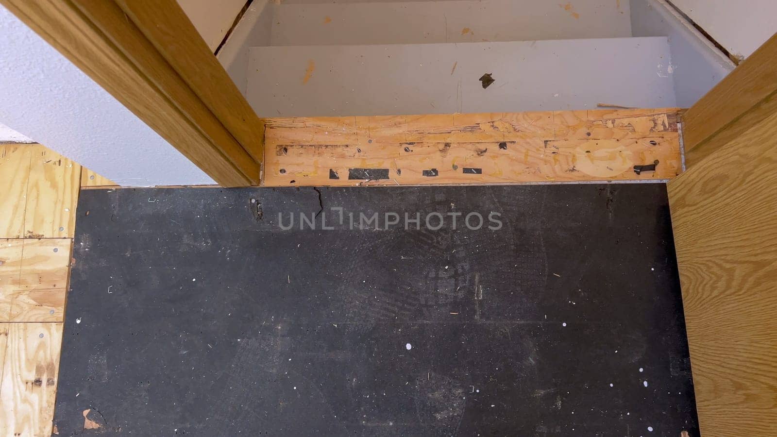 Home Renovation Project: Hardwood Flooring Installation in Progress by arinahabich