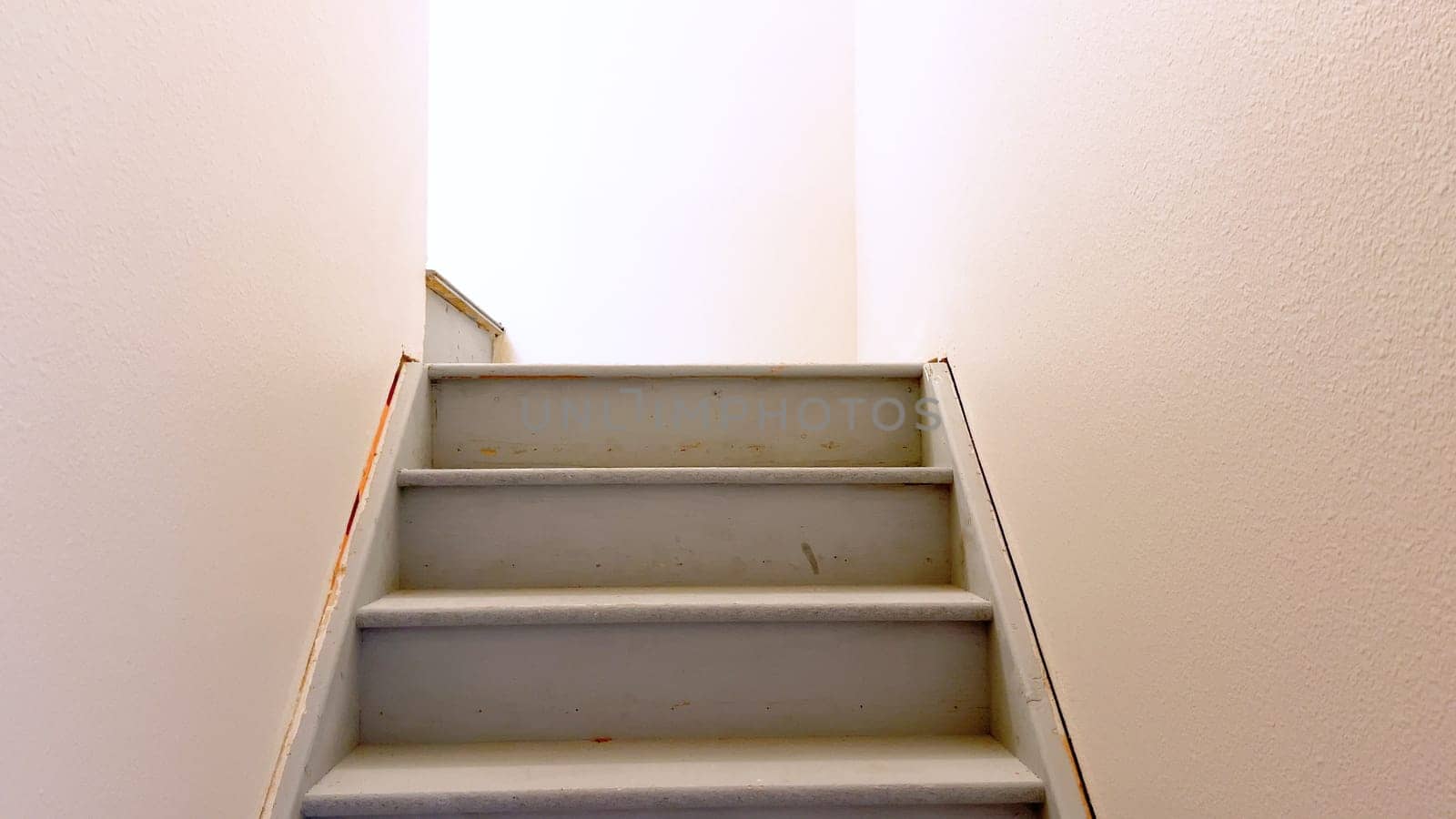 Simple White Staircase Leading to the Basement by arinahabich