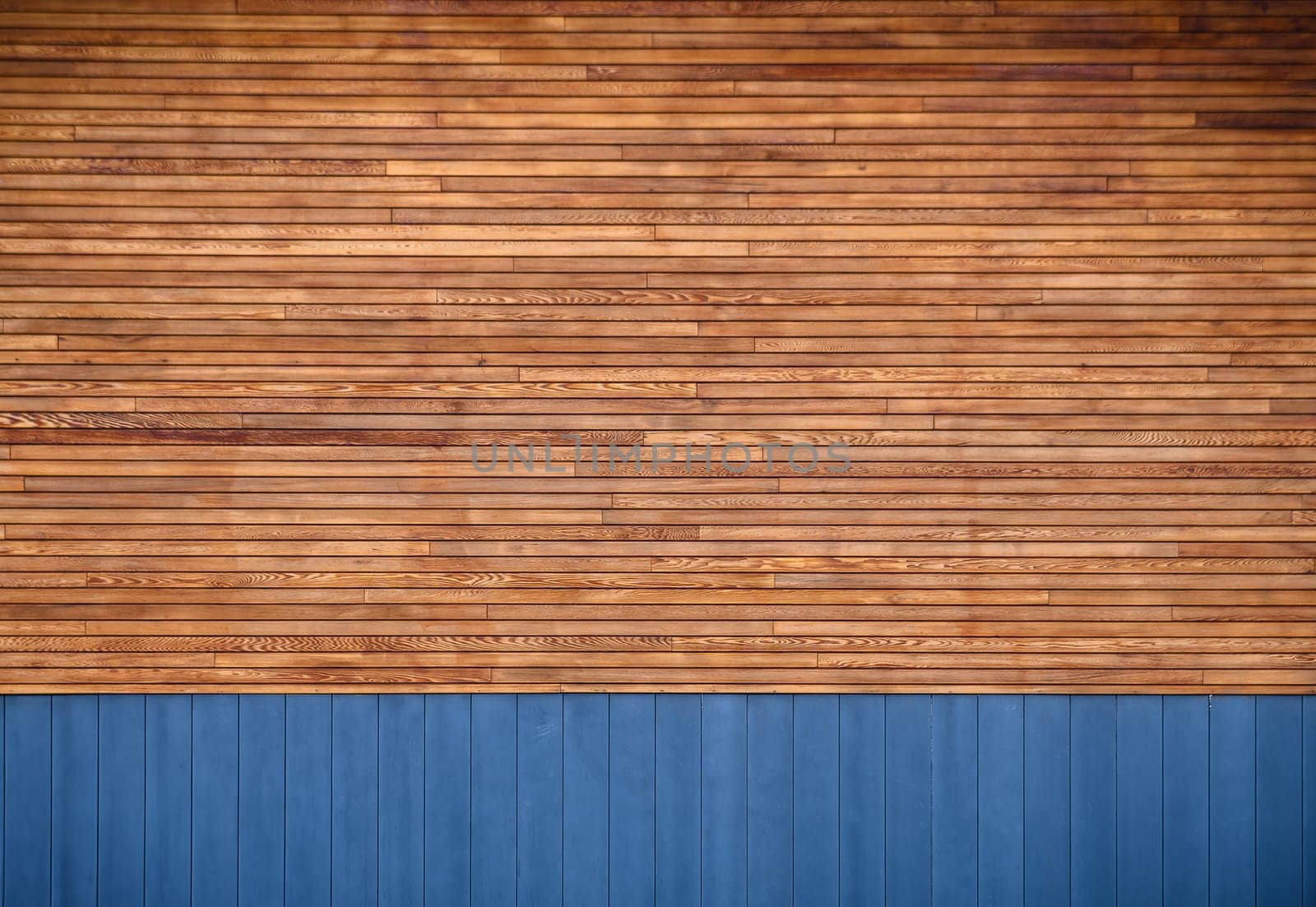 blue metal siding and wooden boards on the facade as a background by Mixa74