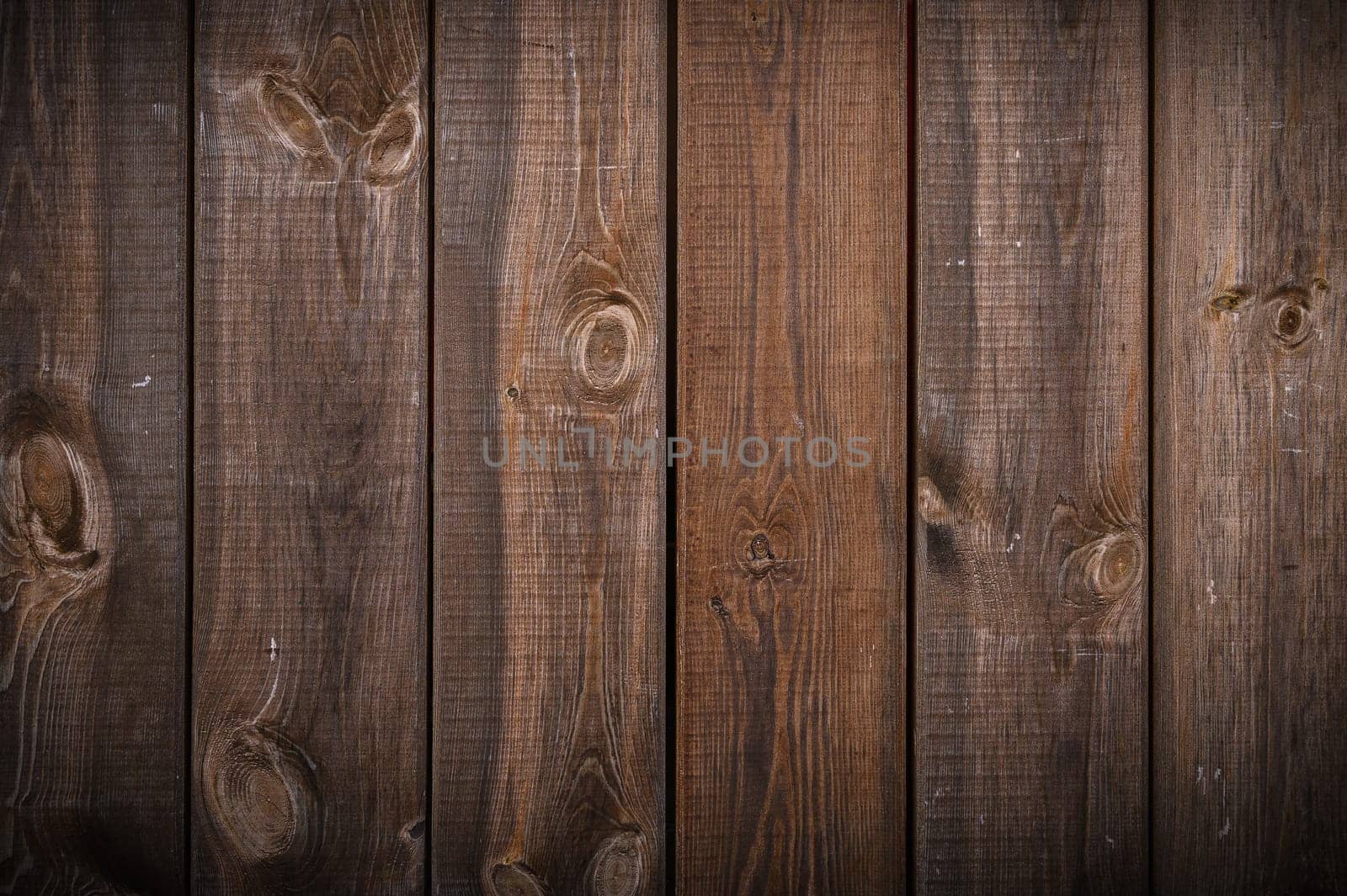 Background of old brown boards with visible grain and damage.