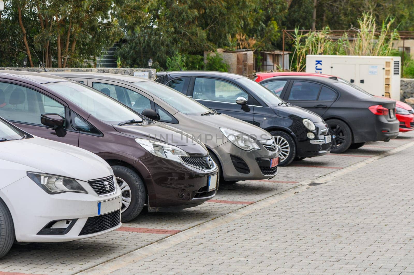 Cars parked in front of a modern residential complex in Cyprus