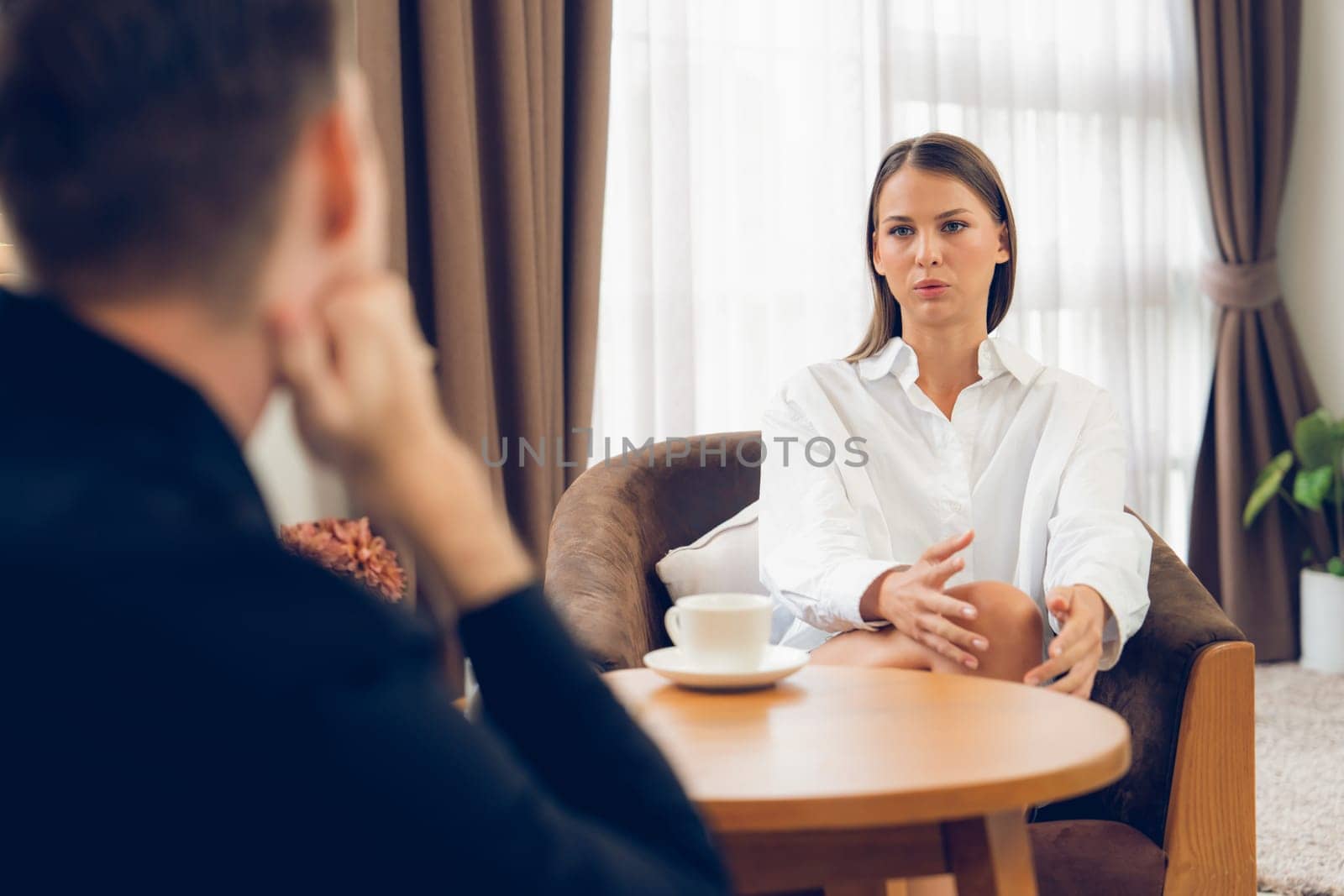 Psychological consultation gaining improvement on mental problem, happy young female patient doing therapy session while psychiatrist making diagnostic on mental illness. Unveiling