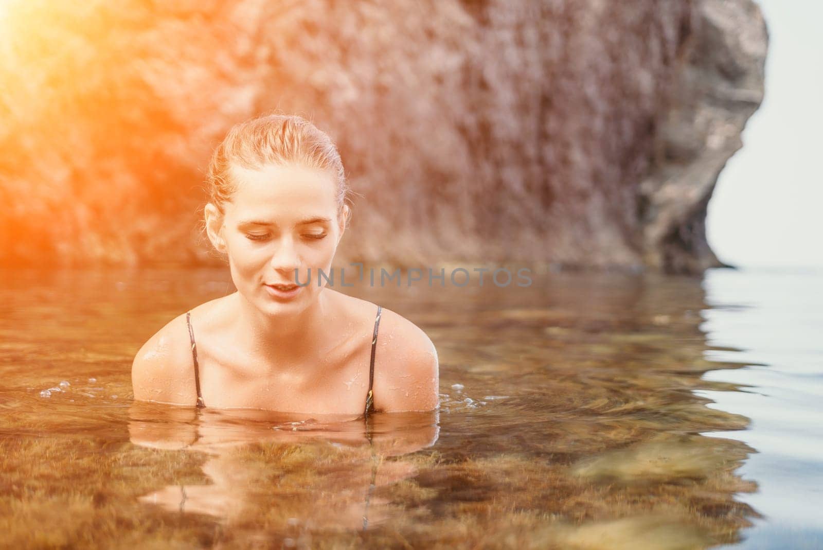 Woman travel sea. Happy tourist enjoy taking picture outdoors for memories. Woman traveler swim in the sea bay with mountains, sharing travel adventure journey by panophotograph