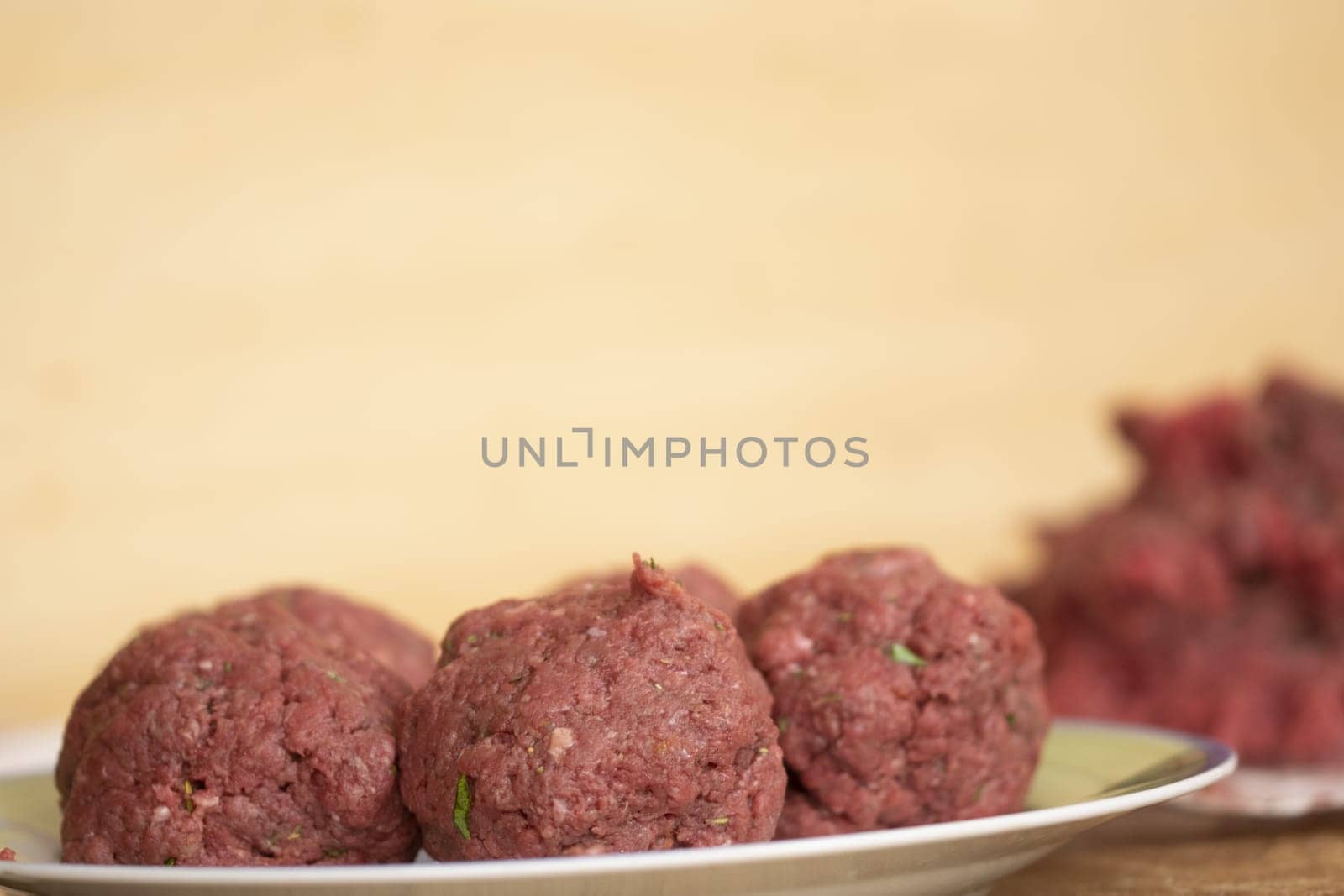 raw beef meatballs ready to be cooked