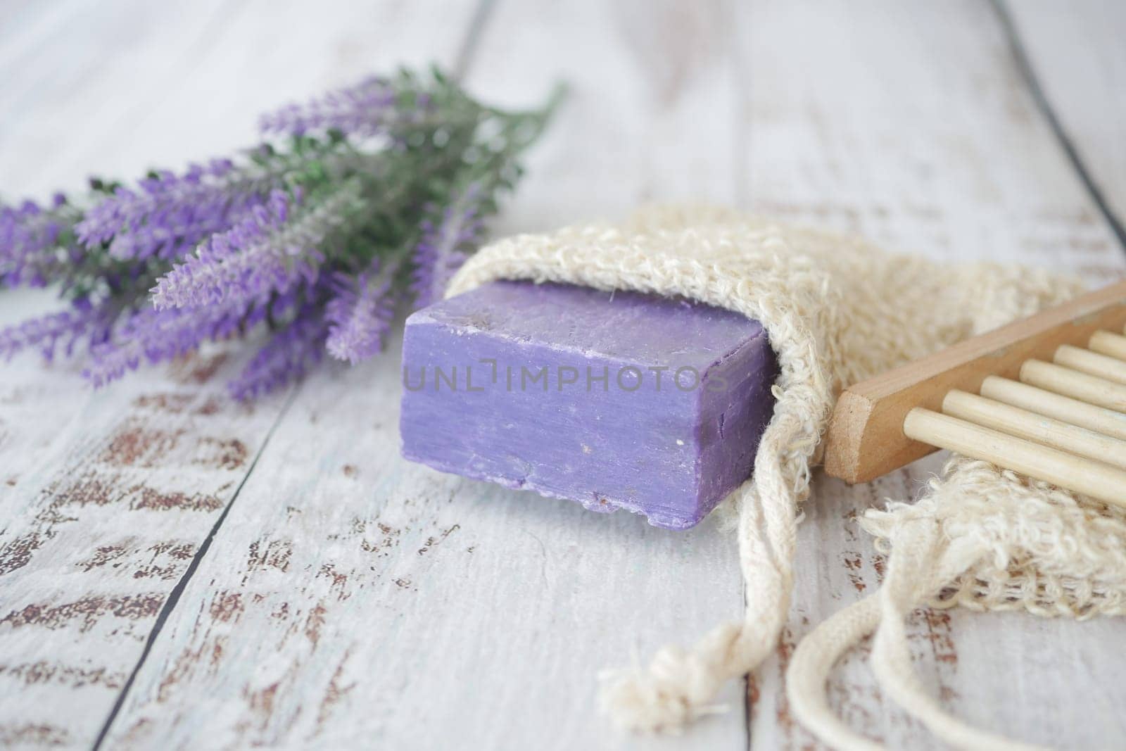 Homemade natural soap bar and lavender flower on table by towfiq007