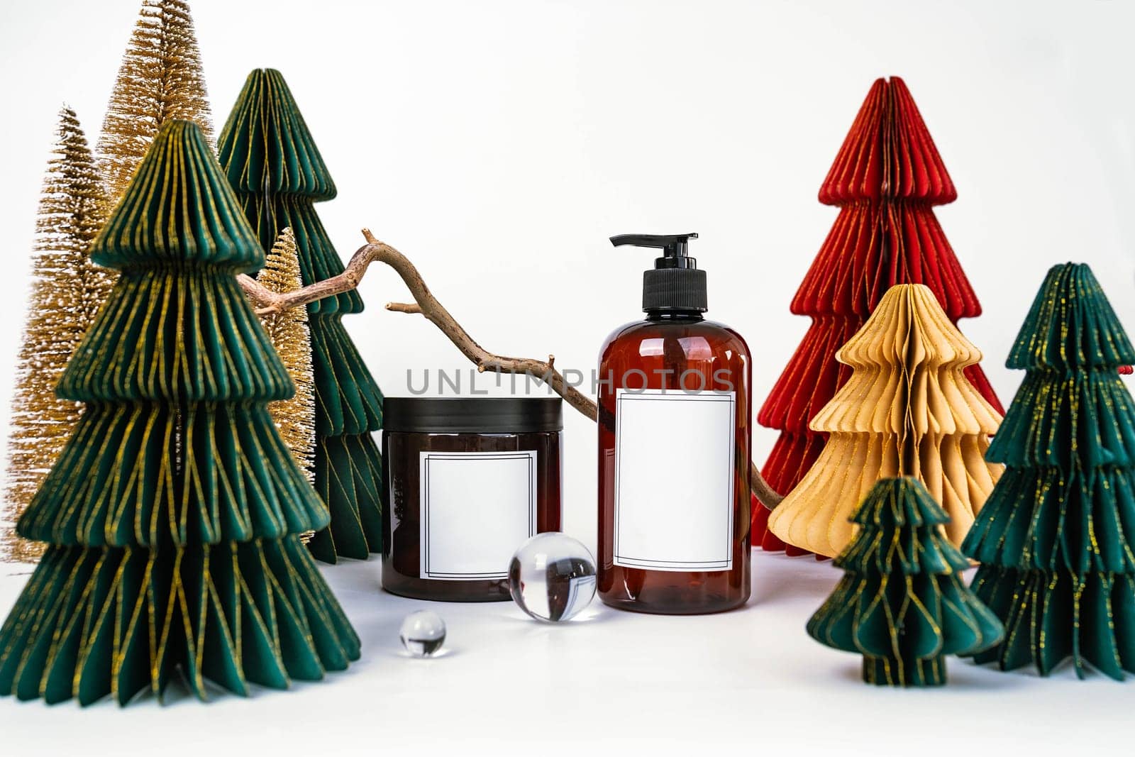 dark jar with lid and dispenser on the background of Christmas decorations, side view by tewolf