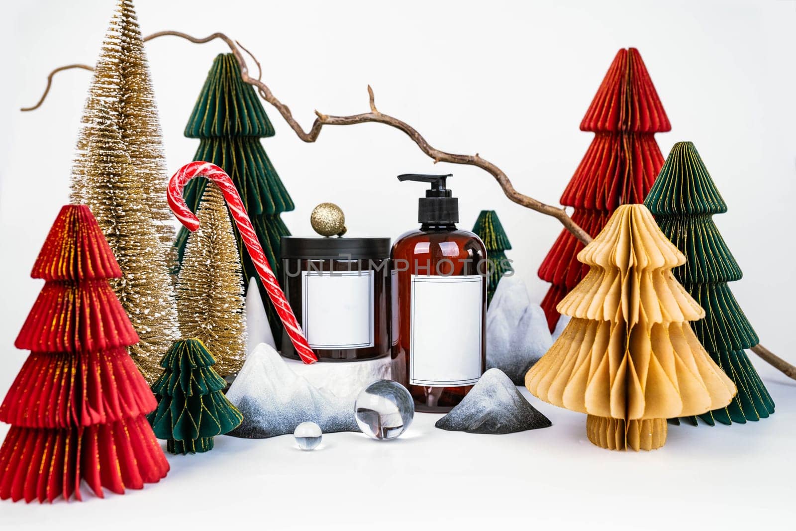 dark jar with lid and dispenser on the background of Christmas decorations, side view by tewolf