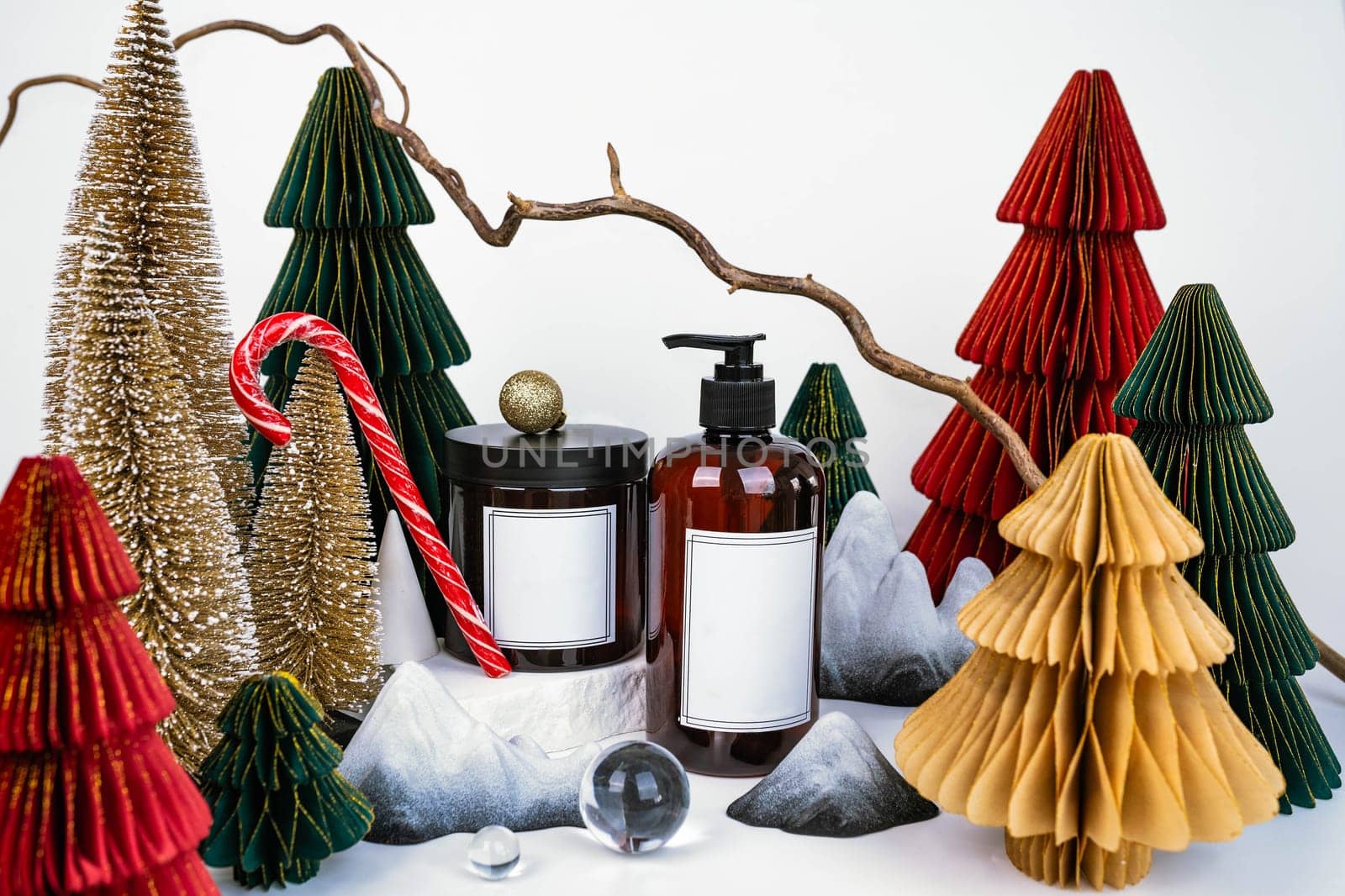 dark jar with lid and dispenser on the background of Christmas decorations